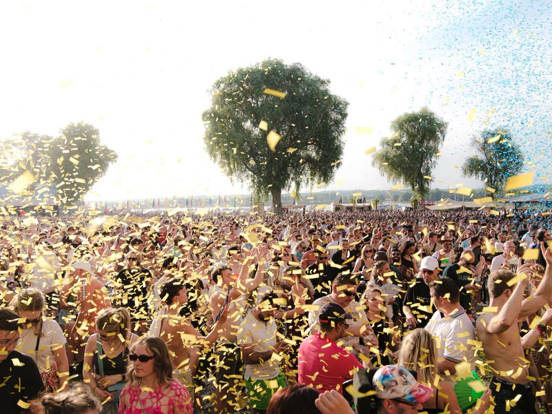 Confetti falling over a festival crowd